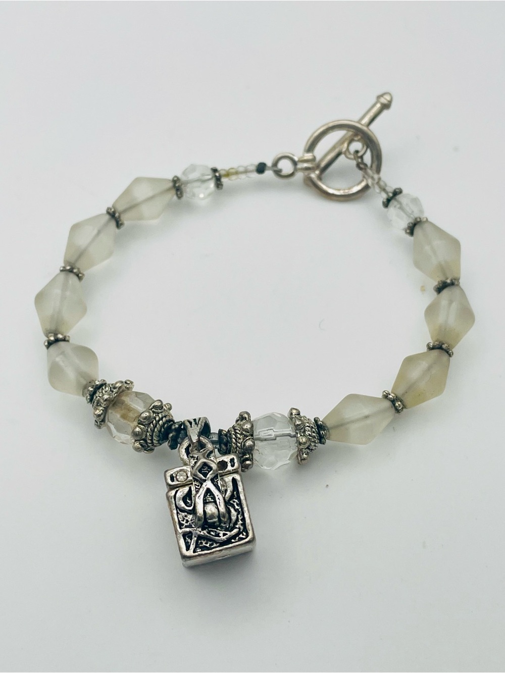 Frosted Crystal Bead Bracelet with Prayer Box Charm and Toggle Closure. 6 1/2 in